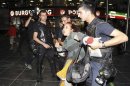 Riot police detain a protester during demonstrations against Turkey's Prime Minister Tayyip Erdogan and his ruling AK Party in central Ankara