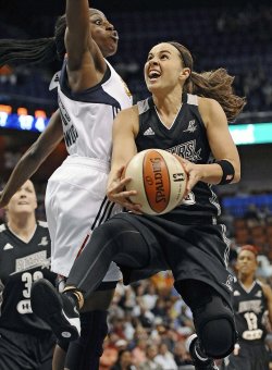 Becky Hammon (right) is retiring from the WNBA at the end of this season. (AP)