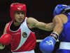 Taylor throws a punch at Khassenova during their women's 60 kg division match at the AIBA World Women's Boxing Championships in Qinhuangdao