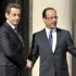 Nicolas Sarkozy (left) welcomes Francois Hollande at the Elysee Palace