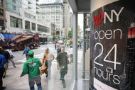 <p> In this Wednesday, May 15, 2013 photo, pedestrians walk in and out of the Walgreens flagship store in the Empire State Building, in New York. The private Conference Board reports on consumer confidence for June, on Tuesday, June 25, 2013. (AP Photo/Mark Lennihan)