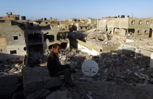 A Libyan man looks at a destroyed building in Laithi&nbsp;&hellip;