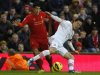 Liverpool's Suarez challenges Southampton's Yoshida during their English Premier League soccer match at Anfield in Liverpool