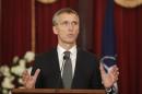 NATO Secretary General Stoltenberg gestures as he speaks during a news conference in Riga