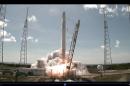 This June 28, 2015 grab from NASA TV shows the SpaceX Falcon 9 rocket with the unmanned Dragon cargo capsule on board Launches from Cape Canaveral, Florida
