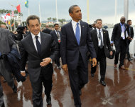 French President Nicolas Sarkozy, left, and US President Barack Obama walk together during arrivals for the G20 summit in Cannes, France on Thursday, Nov. 3, 2011. French President Nicolas Sarkozy will welcome Barack Obama of the U.S., Hu Jintao of China as well as the leaders of India, Brazil, Russia and the other members of the Group of 20 leading world economies in the city made famous by its annual film festival, but the event is far from the star turn the unpopular French leader had hoped to make six months before he faces a tough re-election vote. (AP Photo/Philippe Wojazer, Pool)
