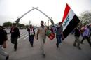 Followers of Iraqi Shi'ite cleric Moqtada al-Sadr leave the Green Zone in Baghdad