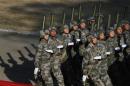 Soldiers of the Chinese People's Liberation Army march during their drill ahead of their year-end review in Jiaxing