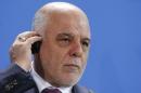 Iraq's Prime Minister al-Abadi listens to a translation during a news conference at the Chancellery in Berlin
