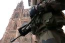 A French soldier stands guard near Strasbourg's cathedral