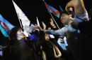 Supporters of Azerbaija's President Aliyev celebrate his victory on the presidential elections in Baku