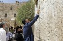 Republican presidential candidate and former Massachusetts Gov. Mitt Romney places a prayer note as he visits the Western Wall in Jerusalem, Sunday, July 29, 2012. (AP Photo/Charles Dharapak)