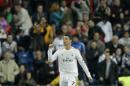Real's Cristiano Ronaldo celebrates scoring his second goal during a Champions League round of 16, second leg, soccer match between Real Madrid and Schalke 04 at the Santiago Bernabeu stadium in Madrid, Tuesday March 18, 2014. (AP Photo/Paul White)