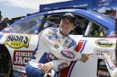 A.J. Allmendinger poses by his car after winning the pole position qualifying for the NASCAR Sprint Cup Series auto race Saturday, June 27, 2015, in Sonoma, Calif. (AP Photo/Eric Risberg)