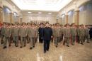 This picture taken by North Korea's official Korean Central News Agency (KCNA) on July 8, 2015 shows North Korean leader Kim Jong-Un (C) and Korean People's Army (KPA) commanding officers visiting the Kumsusan Palace of the Sun in Pyongyang