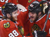 Chicago Blackhawks center Andrew Shaw is hugged by teammate Patrick Kane after Shaw's game-winning goal in the third overtime during Game 1 in the NHL Stanley Cup Final hockey series , Wednesday, June 12, 2013, in Chicago. The Blackhawks won 4-3. (AP Photo/Daily Herald,  John Starks)