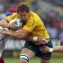 Russia's Artem Fatakhov and Andrey Kuzin tackle Australia Wallabies' Scott Higginbotham during their Rugby World Cup Pool C match at Trafalgar Park in Nelson