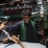 Imran Khan, chairman of political party Pakistan Tehreek-e-Insaf, cheers his supporters after visit to mausoleum of Mohammad Ali Jinnah during election campaign in Karachi
