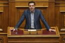 Greek Prime Minister Alexis Tsipras selivers his speech as he attends a parliamentary session in Athens