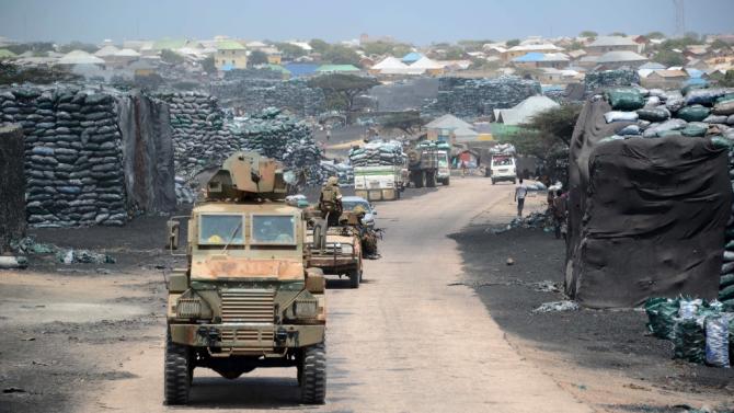 Kenyan convoys patrol near the Kismayo seaport in Somalia on February 27, 2013
