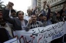 Pakistani journalists chant slogans during a protest outside the press club in Karachi