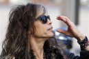 Aerosmith's Steven Tyler adjusts his sunglasses in Boston, Massachusetts