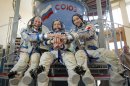 European Space Agency astronaut Parmitano, NASA astronaut Nyberg and Russian cosmonaut Yurchikhin join hands before training examination at the Star City space centre outside Moscow