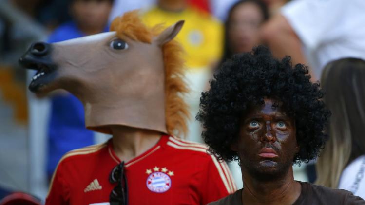 Fans watch the 2014 World Cup Group G soccer match between Germany and Ghana at the Castelao arena