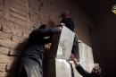 An image from a video from Jihadist media outlet Welayat Nineveh on April 11, 2015 allegedly shows members of the Islamic State group destroying a stoneslab at what they said was the ancient Assyrian city of Nimrud