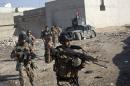Heavy fighting as Iraqi troops drive deeper into Mosul