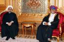 Omani leader Sultan Qaboos bin Said (right) and Iranian President Hassan Rouhani sit during a welcome ceremony in Muscat on March 12, 2014
