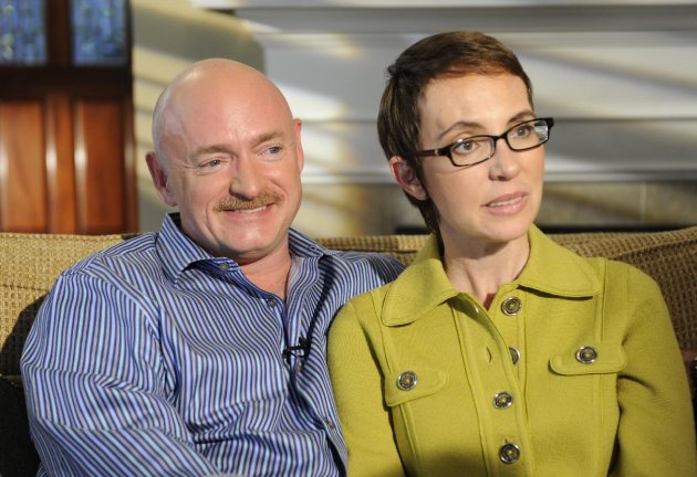 In this undated photo provided by ABC, U.S. Rep. Gabrielle Giffords and husband Mark Kelly are interviewed by Diane Sawyer on ABC's 20/20. The show, featuring the first public interview Giffords has given since she was shot in the head in Tucson last winter, will air Monday, Nov. 14, 2011. (AP Photo/ABC, Ida Mae Astute)