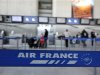 Passengers check-in at Air France desk in Nice International airport