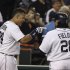 Detroit Tigers' Miguel Cabrera, left, points to teammate Prince Fielder after Fielder's two-run home run during the fifth inning of a baseball game against the Minnesota Twins in Detroit, Tuesday, April 30, 2013. (AP Photo/Carlos Osorio)