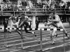 File- This July 26, 1952 file photo shows Milt Campbell, center, of Plainfield, N.J. getting set to clear the final hurdle to make him the winner in the fifth heat of the 110-meter hurdles event in the Olympic decathlon at Helsinki, Finland. Campbell, who became the first black to win the Olympic decathlon in 1956 and went on to play professional football and become a motivational speaker, died Friday Nov. 2, 2012 after a battle with prostate cancer. He was 78.   (AP Photo/File)