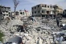 Distruzione dopo gli attacchi missilistici in un quartiere di Damasco