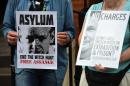 Supporters of WikiLeaks founder Julian Assange demonstrate outside the Ecuadorian Embassy in London on July 16, 2014