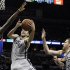 San Antonio Spurs guard Ginobili shoots against Golden State Warriors forward Green during their NBA basketball game in San Antonio, Texas