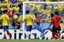 Mexico's goalkeeper Guillermo Ochoa, center, makes a save during the group A World Cup soccer match between Brazil and Mexico at the Arena Castelao in Fortaleza, Brazil, Tuesday, June 17, 2014. (AP Photo/Andre Penner)