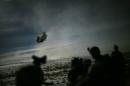 A Chinook helicopter lands to pick up U.S. soldiers of the 101st Airborne Division following a night raid in Yahya Khel