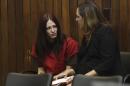 Alix Catherine Tichelman sits in the courtroom with her attorney, Athena Reis, during her arraignment in Santa Cruz