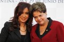 Argentina's President Cristina Fernandez de Kirchner and her Brazilian counterpart Dilma Rousseff pose for a photograph before the Mercosur trade bloc presidential summit in Mendoza