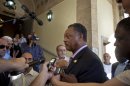 The Rev. Jesse Jackson talks with journalists as he arrives to the Hotel Nacional in Havana, Cuba, Friday, Sept. 27, 2013. Jackson says he is in town for talks with religious leaders about their concerns for the poor, and peaceful relations between Cuba, the United States and the rest of the Caribbean. Jackson says he also hopes to meet with jailed American government subcontractor Alan Gross. (AP Photo/Ramon Espinosa)