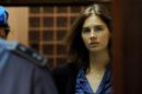 Amanda Knox, US national accused of the 2007 murder of her housemate Meredith Kercher, arrives at the court during the resumption of her appeal trial in Perugia on September 30, 2011