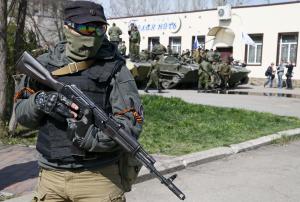 An armed man stands guard in Slaviansk
