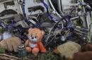 A teddy bear is placed next to wreckage at the site of the downed Malaysia Airlines flight MH17, near the village of Hrabove (Grabovo) in Donetsk region, eastern Ukraine