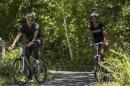 U.S. President Obama cycles with his daughter Malia during their family vacation at Martha's Vineyard in Massachusetts