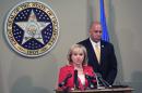 Oklahoma Gov. Mary Fallin, front, issues a statement to the media on the Execution of Clayton Lockett as Oklahoma Secretary of Safety and Security Michael C. Thompson, back, listens from the Oklahoma State Capitol in Oklahoma City on Wednesday, April 30, 2014. Lockett apparently died of a massive heart attack during his botched execution. (AP Photo/Alonzo Adams)