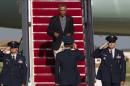 President Barack Obama walks down the stairs of Air Force One upon arrival at Andrews Air Force Base, Md., Monday, Sept. 1, 2014. (AP Photo/Jose Luis Magana)