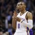 Oklahoma City Thunder guard Russell Westbrook gestures after hitting a 3-point shot to end the first quarter of an NBA basketball game against the Los Angeles Lakers in Oklahoma City, Friday, Dec. 7, 2012. Lakers' Darius Morris is at rear (AP Photo/Sue Ogrocki)